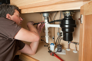 Jack is repairing a broken garbage disposal